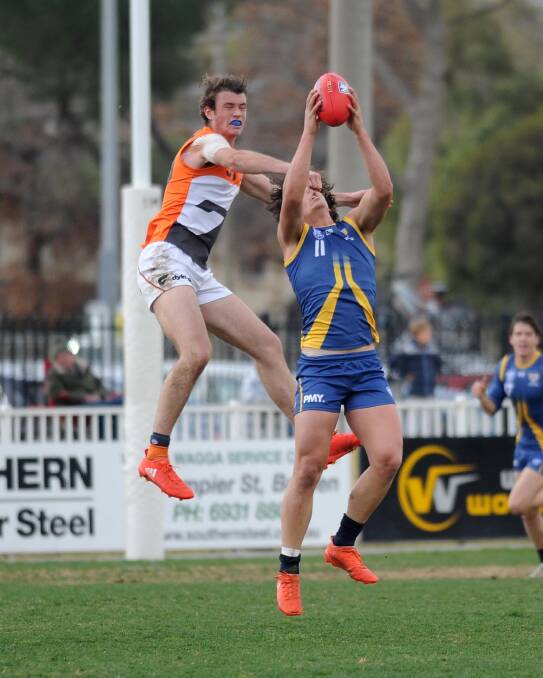 Jacob Turner takes a strong mark for Canberra Demons in a NEAFL game at Wagga in 2017.