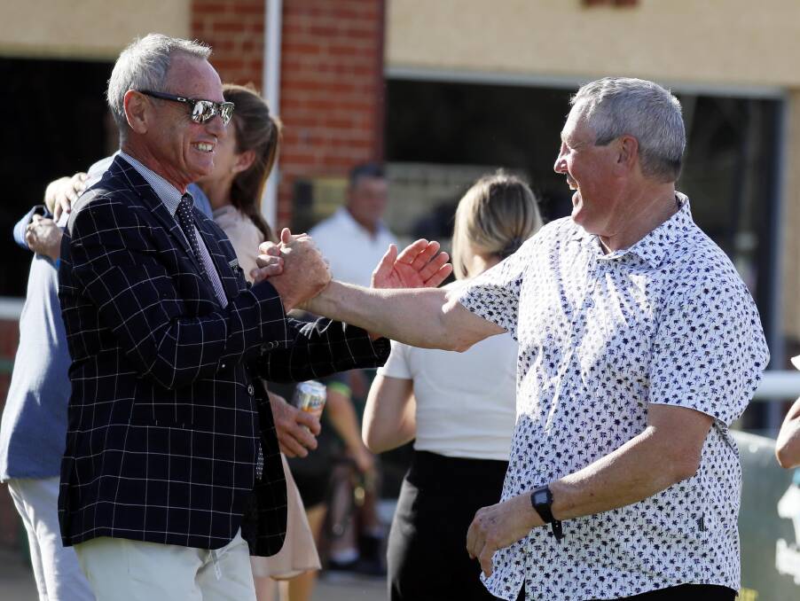 Part-owner Scott Oehm and Gary Colvin celebrate Another One's win in the SDRA Qualifier.
