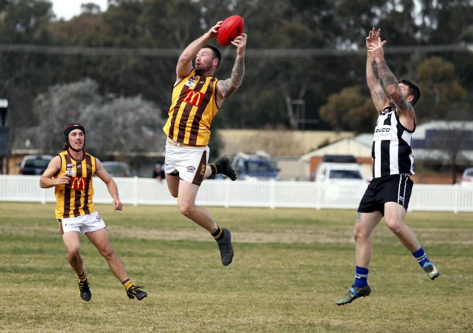 CUT OFF: East Wagga-Kooringal defender Trent Garner marks in front of The Rock-Yerong Creek's Tim Post at Victoria Park on Saturday. Picture: Les Smith