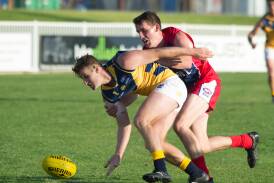 AFL Canberra's Brett Fruend leads Riverina League's Tom Meline to the ball during an interleague game at Robertson Oval in 2017. Picture by Laura Hardwick