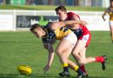 AFL Canberra's Brett Fruend leads Riverina League's Tom Meline to the ball during an interleague game at Robertson Oval in 2017. Picture by Laura Hardwick