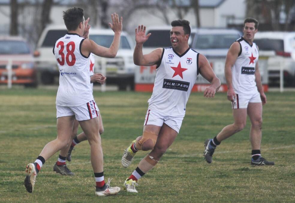Ben Alexander and Ned Mortimer celebrate a North Wagga first quarter goal against Marrar last Saturday.