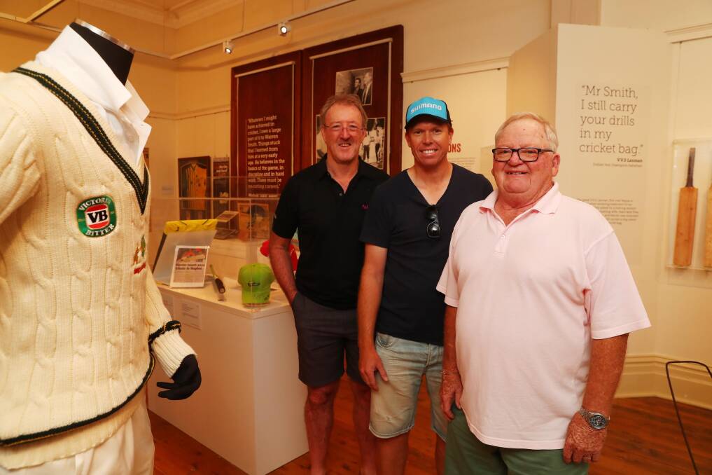 Warren Smith (right) with Geoff Lawson and Dominic Thornely at the exhibition in his honour 'Wazza, A Local Legend' in Wagga last year. Picture: Emma Hillier