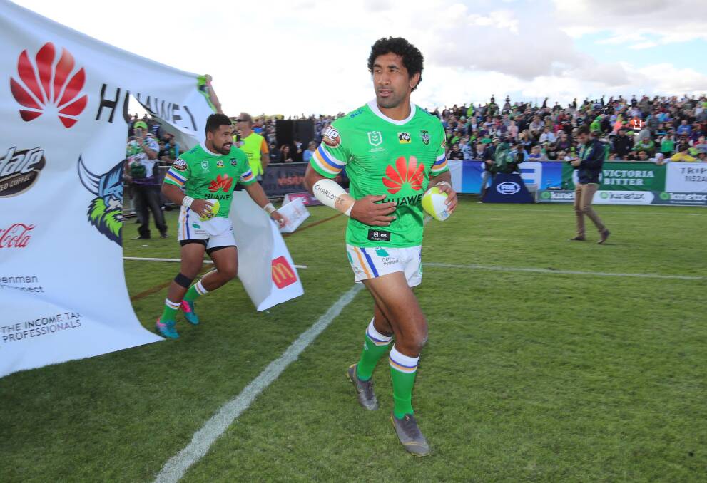 BRILLIANT: Canberra Raiders run out onto Equex Centre for the first NRL game in the city in 20 years. Picture: Les Smith