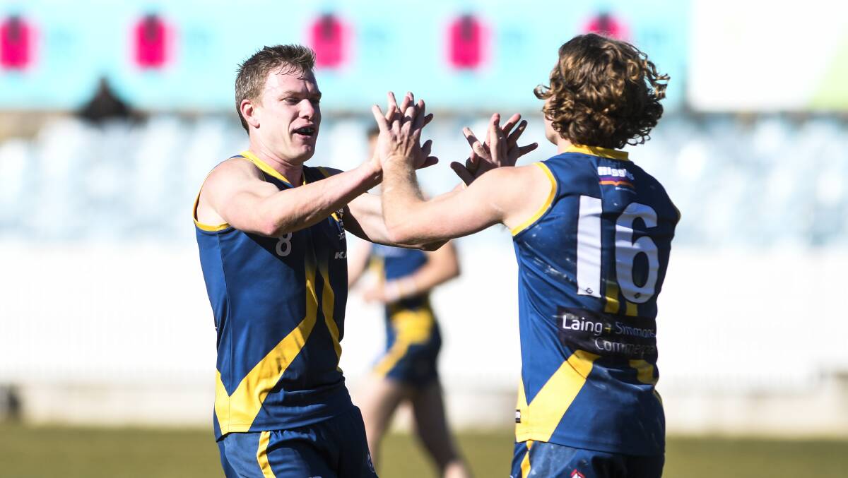 HEADED HOME: Mitch Maguire (left) celebrates a goal for Canberra Demons with Mitch Hardie last season. Picture: Dion Georgopoulos