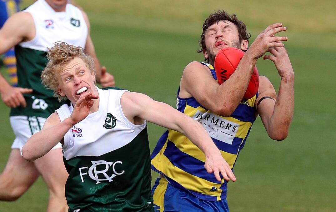 CONTEST: MCUE's Jacob Whitley marks despite close attention from Coolamon's Luke Redfern at Kindra Park on Saturday. Picture: Les Smith