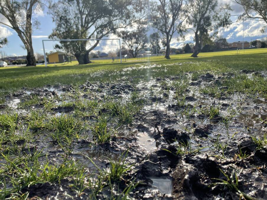 STUCK IN THE MUD: Sections of Rawlings Park on Sunday. Football Wagga deemed all games scheduled for Sunday a washout. Picture: Matt Malone