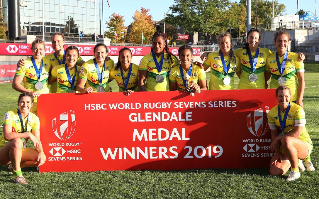 SILVER LINING: The Australian women's rugby sevens team show off their silver medals after losing to the USA on Monday. Picture: World Sevens Rugby