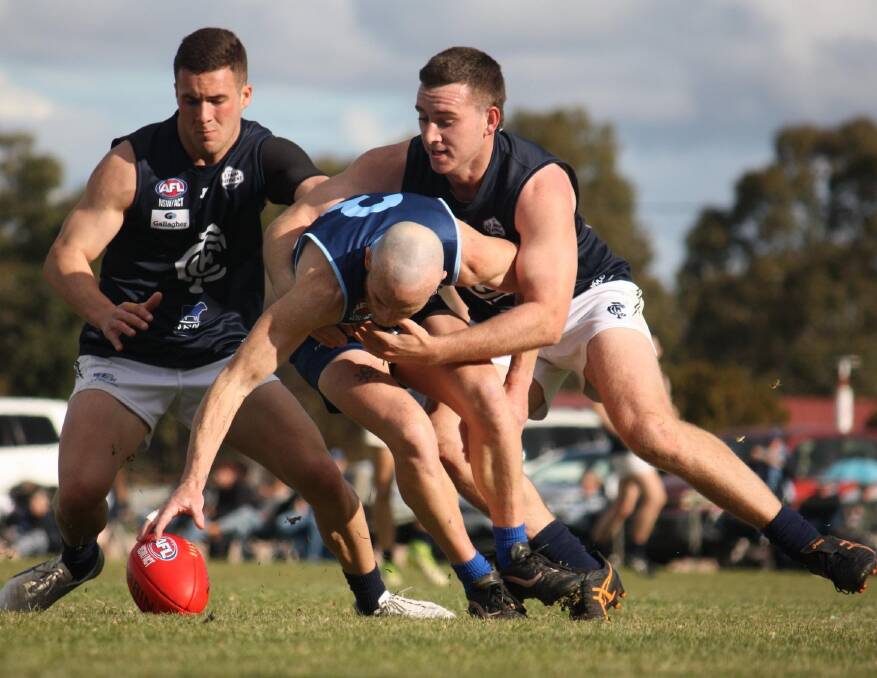RELENTLESS: Coleambally players apply pressure to one of Barellan's milestone men, Kabe Stockton, in the game at Barellan on Saturday. Picture: Barellan FNC