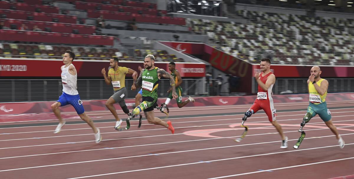 CLOSE CALL: Scott Reardon (right) competes in the Men's 100m T63 final at the Tokyo Paralympics on Monday night. Picture: Takehiko Suzuki, AP