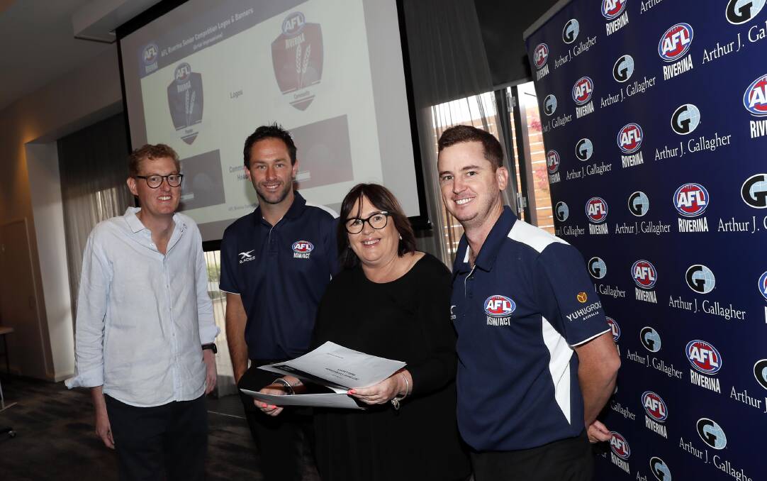 MOVING FORWARD: AFL Riverina chairman Michael Irons (left) and board member Janine Fitzsimmons with AFL NSW-ACT staff Marc Geppert (second from left) and Tom Walker (right) at The Rules Club on Wednesday. Picture: Les Smith
