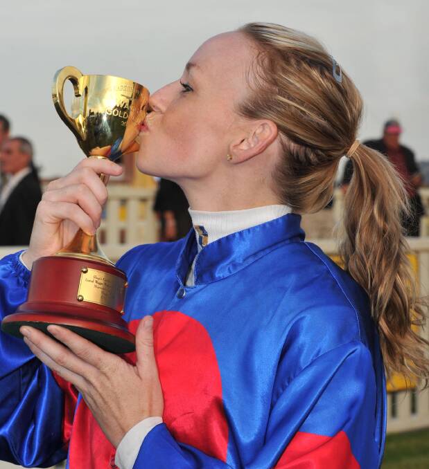 Kathy O'Hara celebrates her 2011 Wagga Gold Cup win. Picture: Les Smith
