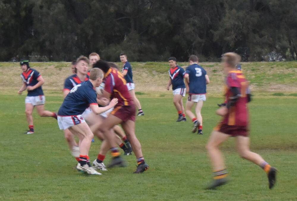 STRONG RUN: Mater Dei Catholic College's Wes Clark is met by the Kildare Catholic College defence in the opening game of this year's Hardy Shield.