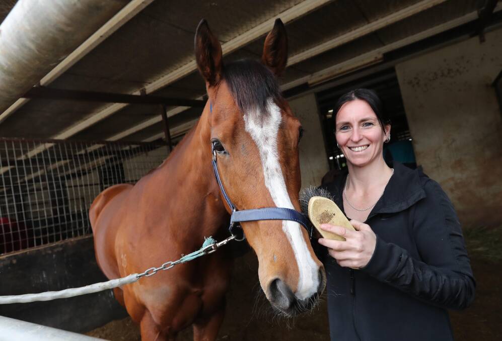MOVING ON: Wagga apprentice jockey Rebeka Prest says goodbye to Quetee Shoes at Tim Donnelly's stables on Wednesday. Picture: Les Smith