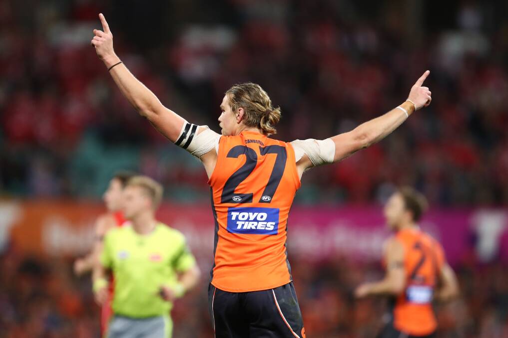 CELEBRATION: Harry Himmelberg celebrates one of his two goals in the Giants' win over Sydney Swans on Saturday. 