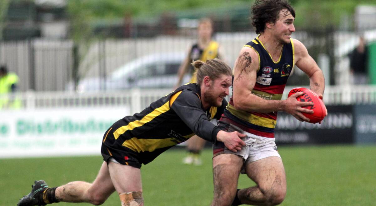 ON THE RUN: Leeton-Whitton's Ben Gaynor tries to escape Wagga Tigers' Jacob Osbeiston in the grand final yesterday. Picture: Les Smith