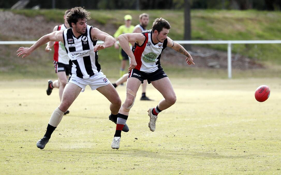 BIG MEN BATTLE IT OUT: The Rock-Yerong Creek's Noah Budd and North Wagga's Matt Parks battle it out at McPherson Oval on Saturday. Picture: Les Smith