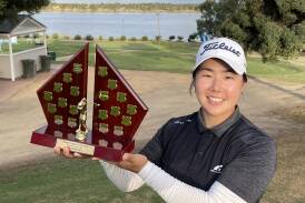 South Korean golfer Cecila Cho shows off the Wagga WPGA Pro-Am trophy after victory in the $50,000 event at Wagga Country Club on Friday. Picture by Matt Malone