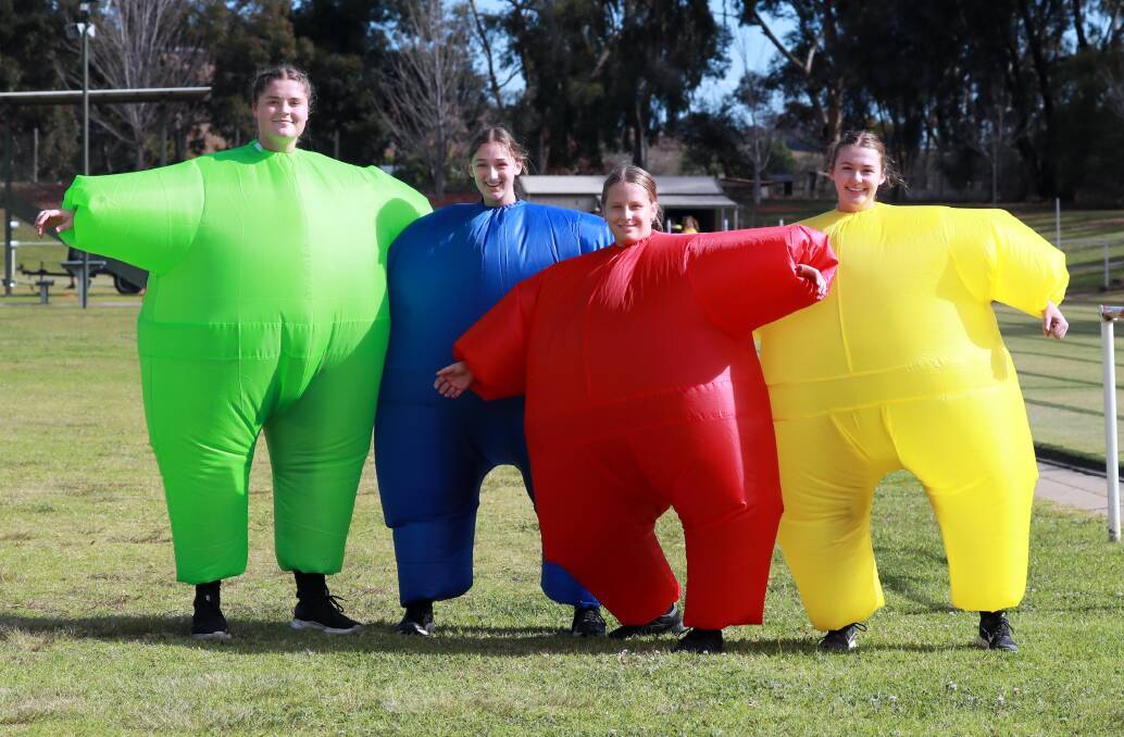 COLOUR: Mindy Quade, Jaime Esler, Jemma Davey and Molly Moorby, all 17 years, got in the spirit of things at last week's Kooringal High School athletics carnival. Picture: Les Smith
