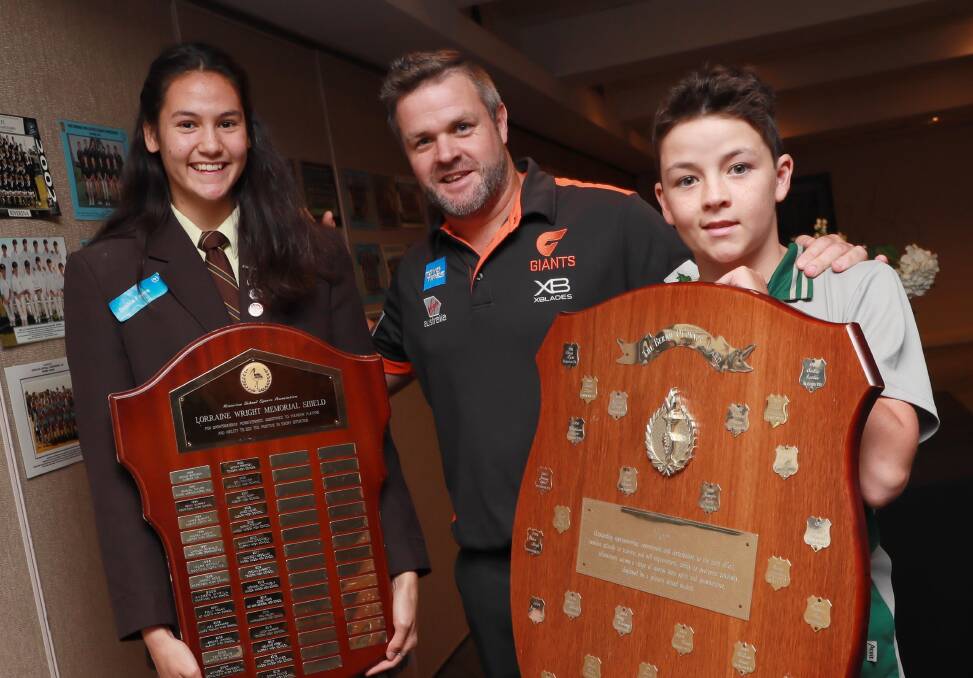 TOP HONOUR: Kooringal High School's Sophie Fawns and Parkview Public School's Tallis McMillan with Adam Schneider at the Riverina School Sports Blues Awards. Picture: Les Smith