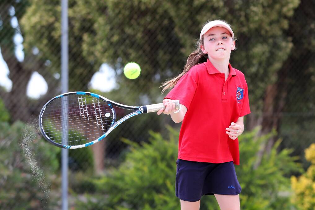 TOO GOOD: Mater Dei Primary School's Inez McPherson, 11, hits a strong forehand during Friday's Kaitlin Staines Cup at South Wagga Tennis Club. Picture: Emma Hillier