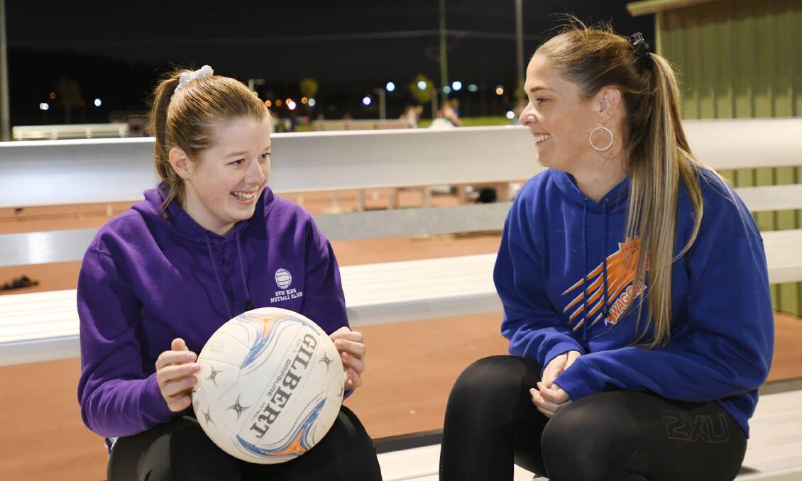SPECIAL BOND: Talented netballer and basketballer Caren Hugo (right) with her daughter Isabella at Wagga Netball Centre on Thursday night.