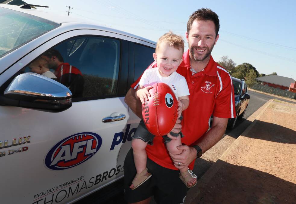 NEW CHAPTER: Collingullie-Glenfield Park full-forward Marc Geppert with Hutch, who turns two on Sunday, after announcing his retirement. Picture: Les Smith