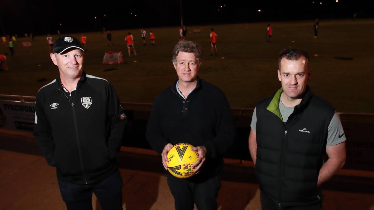 FOUNDING FATHERS: Current president Brendan Flanagan with club founders Marty Loy and Justin Curran at Wagga City Wanderers training on Thursday night. Picture: Les Smith