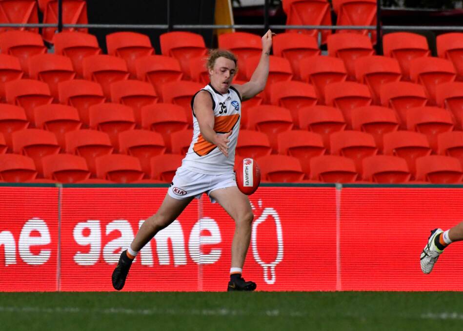 NO REST: Brendy Myers gets a kick for the GWS Giants' against Gold Coast in the North Eastern Australian Football League (NEAFL) at Metricon Stadium on Saturday. Picture: Sharon Vella