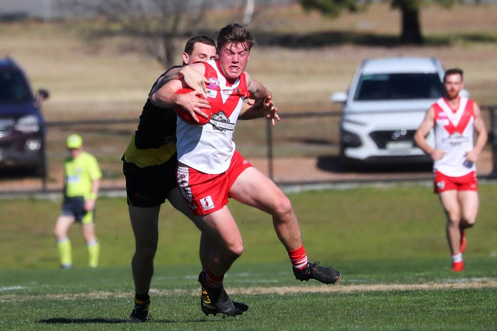 Griffith's Jack Rowston tries to shrug off a tackle at Narrandera Sportsground on Saturday. Picture: Emma Hillier