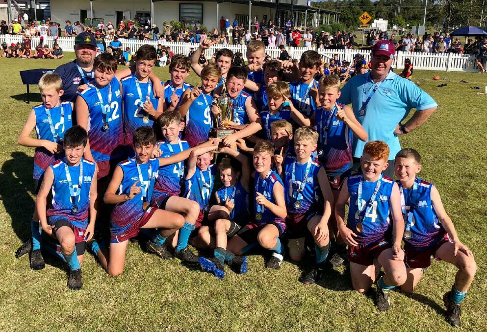 CHAMPIONS: The winning Mackillop team celebrate their win at Byron Bay.