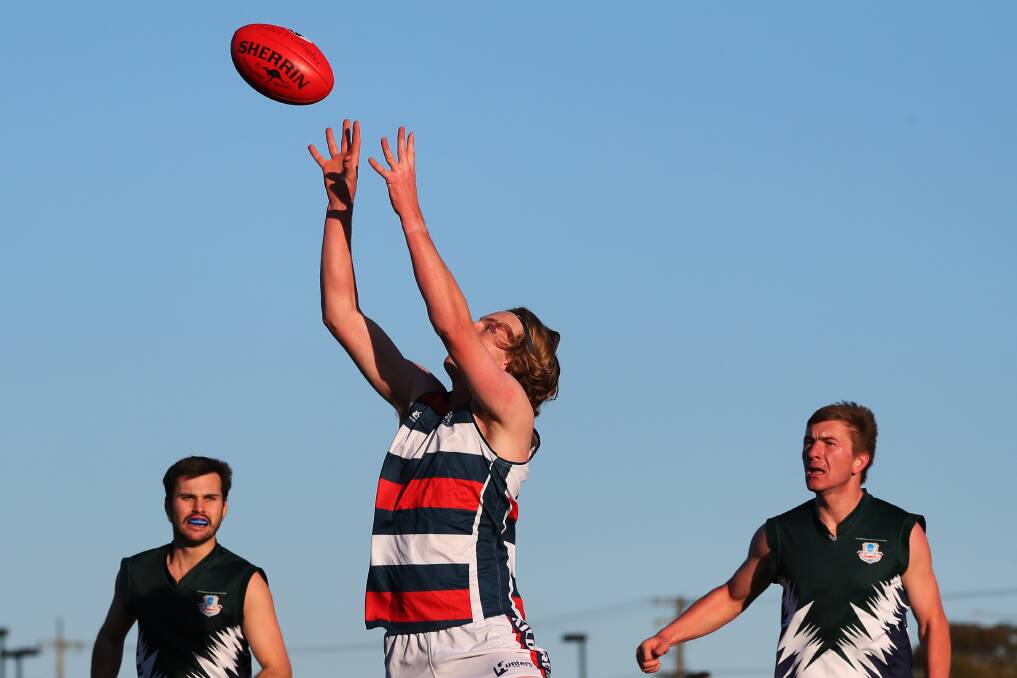 STRONG: Bart Carroll marks for Kildare Catholic College in the opening game against The Riverina Anglican College last Monday. Picture: Emma Hillier