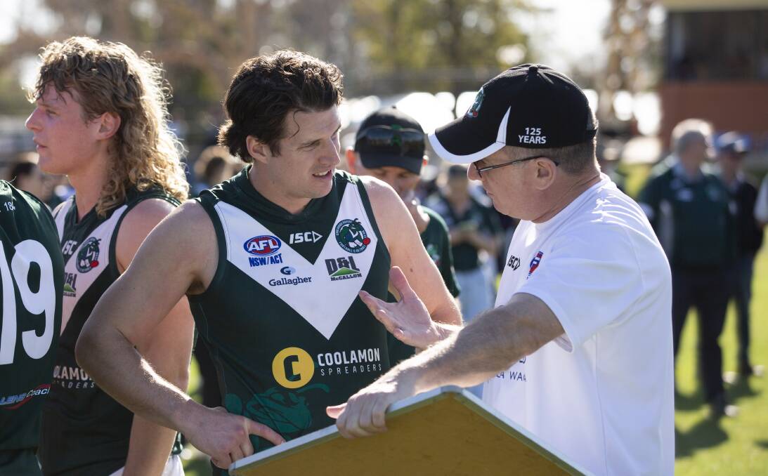 Coolamon co-coach Jake Barrett in a discussion with club secretary Scott Glyde at quarter-time in Sunday's first semi-final at Narrandera Sportsground. Picture by Madeline Begley