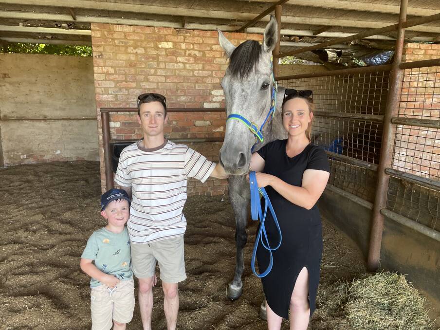 FAMILY: Wagga trainer Maddy Collins, her partner Josh Richards, son Isaac and Bangalee Mist at her stables on Thursday afternoon. Pictures: Matt Malone
