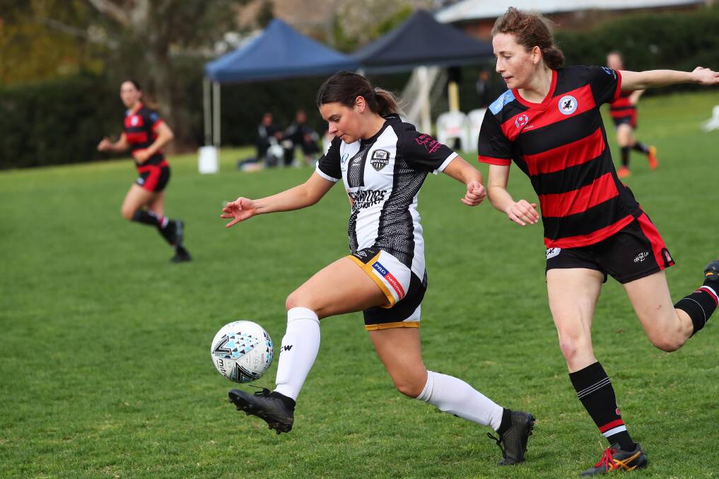 IN CONTROL: Wagga City Wanderers' Brandy Nicholson takes the ball away from Woden Weston's Jemima Millar-Carton at Gissing Oval on Sunday. Picture: Emma Hillier