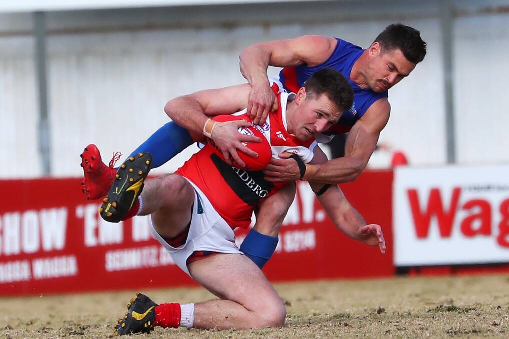 GOTCHA: Turvey Park coach Truman Carroll gets hold of Collingullie-Glenfield Park's Kal Sykes at Maher Oval on Saturday. Picture: Emma Hillier