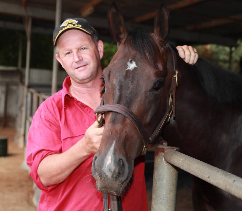 Wagga trainer Chris Heywood with talented three-year-old Blitzar. Picture: Les Smith