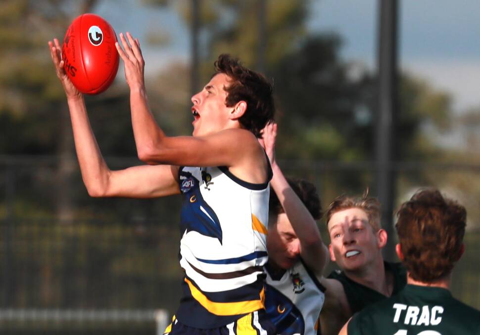 STRONG: Kooringal High School's Hugh Schmetzer takes a mark in the Carroll Cup semi-final against The Riverina Anglican College at Robertson Oval on Wednesday. Picture: Les Smith