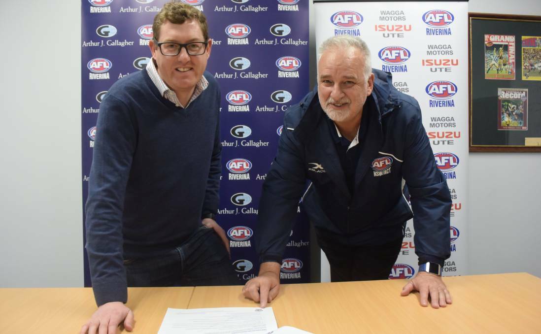EXCITING TIMES: AFL Riverina chairman Michael Irons and independent consutant David Burgess.