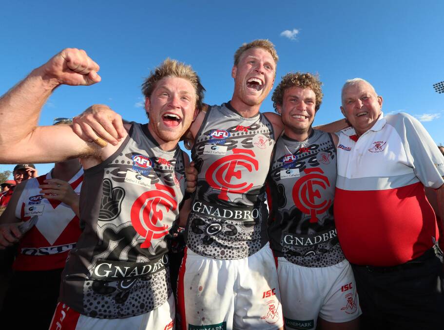 FAMILY AFFAIR: Matt, Ben and Jayden Klemke celebrate their first Riverina League premiership together with grandfather Ian. Picture: Les Smith