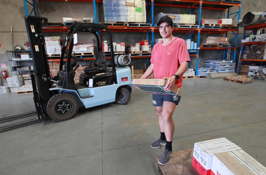 NO REST: Carlton footballer Matt Kennedy busy at work at the family business, Riverina Terrazo, on Thursday. Picture: Les Smith