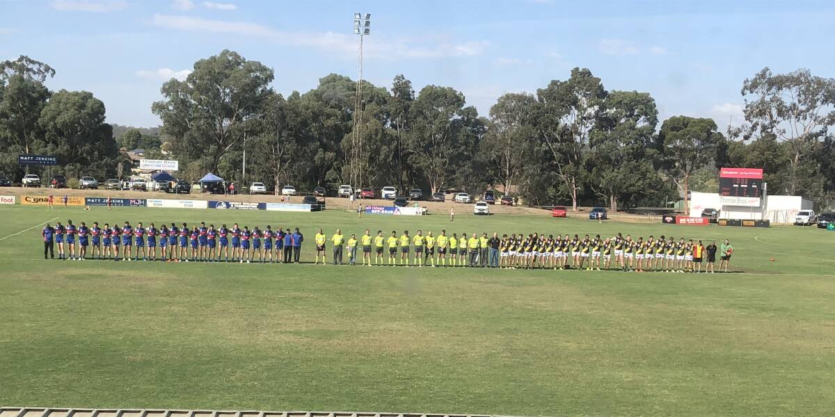 A minute's silence is held before the start of first grade for the passing of Anthony Baker and Jim Daniher.