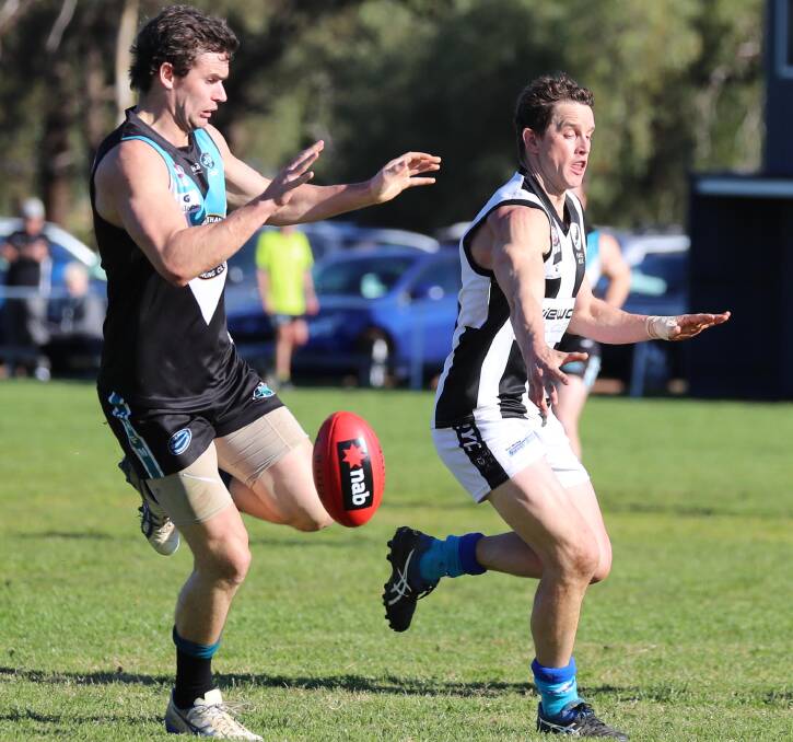 Northern Jets' Matt Wallis and The Rock-Yerong Creek's Todd Hannam compete during last year's Farrer League season.