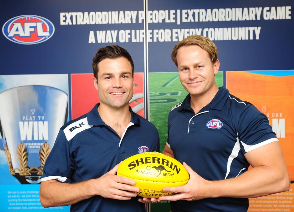 BUSY TIME: AFL NSW-ACT staff manager Sam Chadwick (left) with Dean Connors in Wagga in 2016. Chadwick says changes are likely as part of the review into the AFL Riverina competitions.