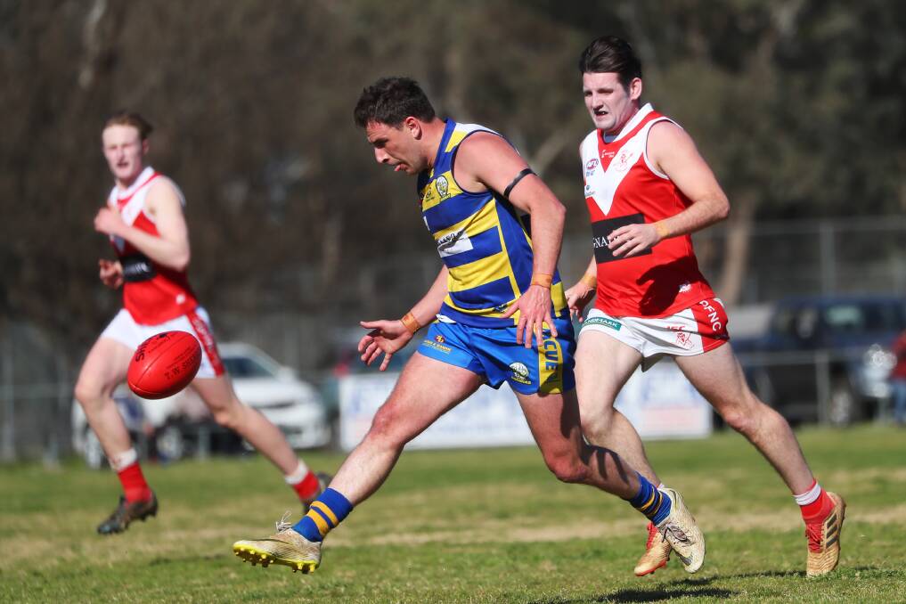 TOO GOOD: MCUE's Dom Bunyan gets a kick away in the win over Collingullie-Glenfield Park at Mangoplah on Saturday. Picture: Emma Hillier