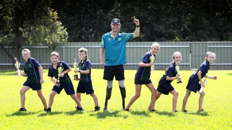 NEXT STEP: Josh Hanlon at North Wagga Public School last month with athletics age champions Ashton Feary, 11, Toby Campbell, 10, Joey Rake, 9, Isabella Baulch, 11, Harper Hann, 10 and Ivy Chobdzynski. Picture: Les Smith