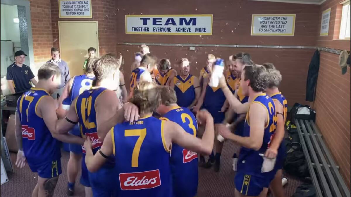 ALL SMILES: Narrandera enjoy belting out the team song for the first time this season on Sunday.