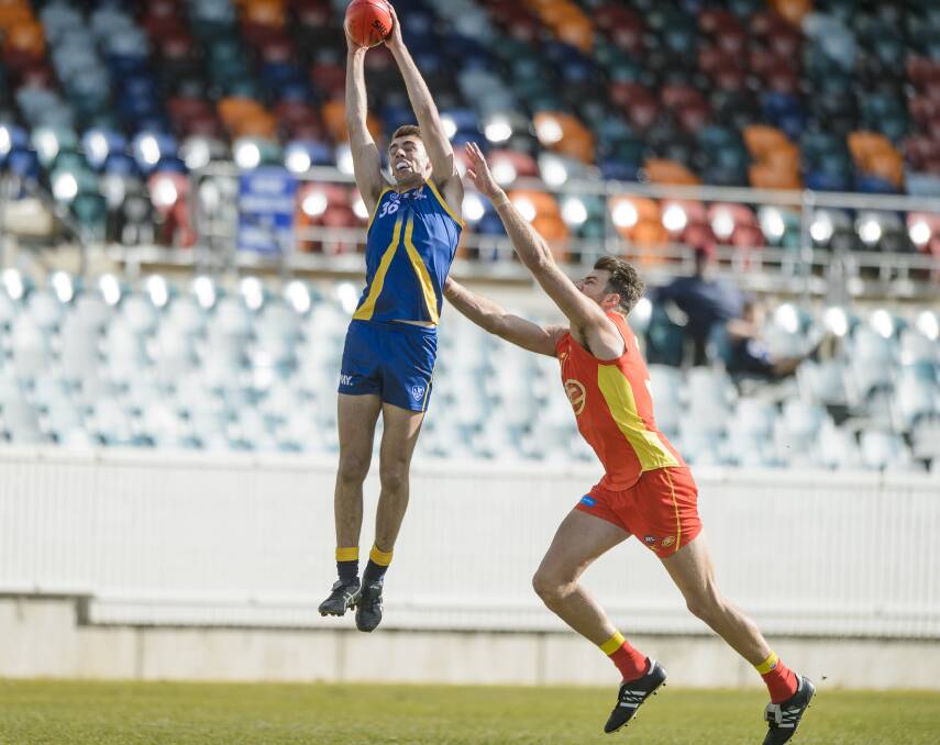 Lucas Meline in action against Gold Coast's Keegan Brooksby in the NEAFL. Picture: Sitthixay Ditthavong