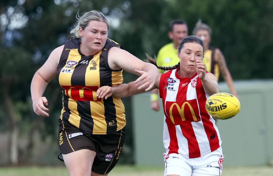 UP FOR GRABS: Charles Sturt University's Sinead Parobiec and East Wagga-Kooringal's Anneke Piercy compete for the ball in the Southern NSW women's game last Friday night at Peter Hastie Oval. Picture: Les Smith