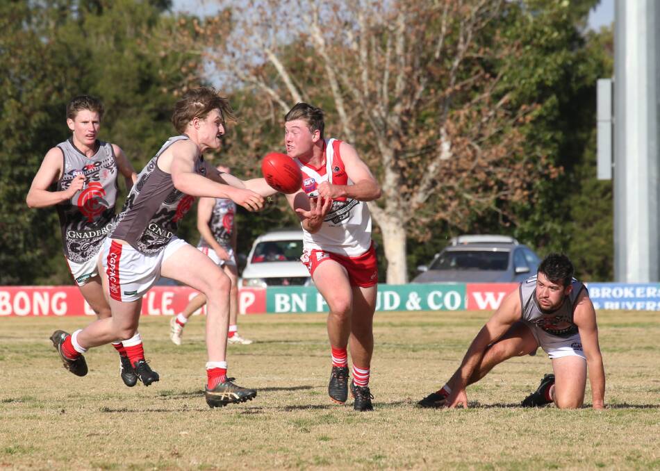 BACK IN ACTION: Griffith's Jack Rowston fires off a handball in his first game back from injury against Collingullie-GP at Exies Oval on Saturday. Picture: Anthony Stipo